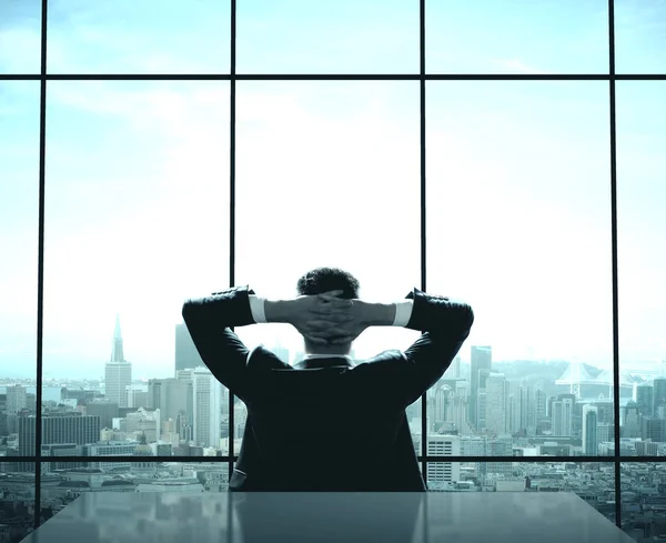 Businessman sitting in office — Stock Photo, Image