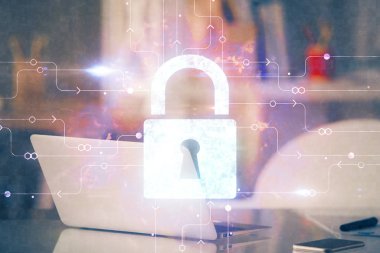 Bilgisayar ve ikon hologramı ile masaüstüne çift pozlama. Veri güvenliği kavramı.