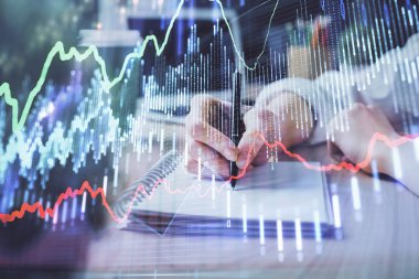 Forex tablosu WOMANS el notları arka plan alarak görüntülenir. Araştırma kavramı. Çift Pozlama