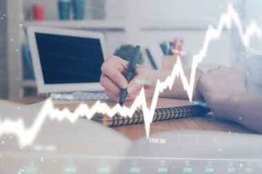 Finansal grafik WOMANS el notları arka plan alarak görüntülenir. Araştırma kavramı. Çift Pozlama