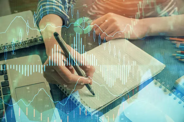 Financial chart drawn over hands taking notes background. Concept of research. Double exposure — Stock Photo, Image