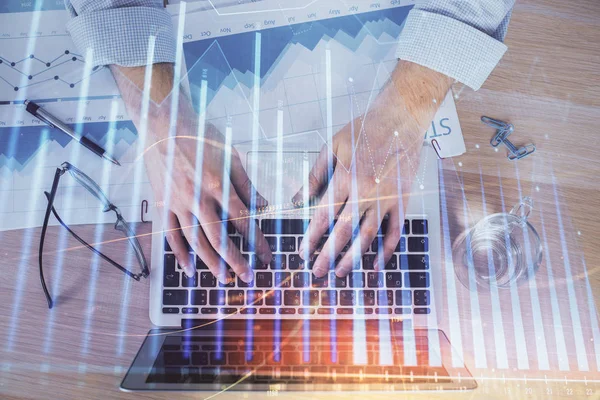 Double exposure of market chart with man working on computer on background. Concept of financial analysis. — Stock Photo, Image