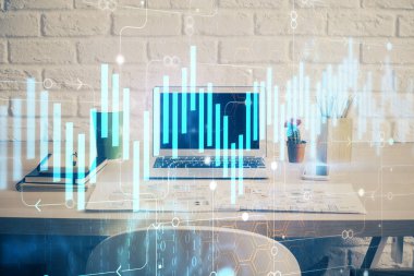 Finansal pazar grafiği hologramı ve kişisel bilgisayar arka planda. Çifte maruziyet. Önx kavramı.