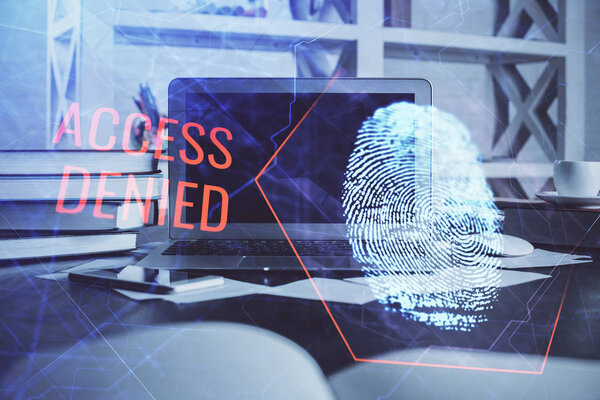 Компьютер на рабочем столе в офисе с рисунком пальца. Двойное воздействие. Концепция защиты бизнес-данных.
