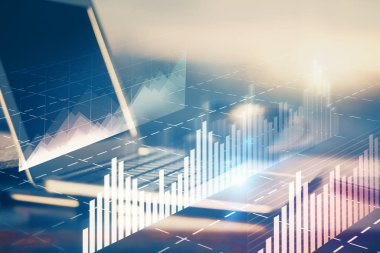 Finansal pazar grafiği hologramı ve kişisel bilgisayar arka planda. Çifte maruziyet. Önx kavramı.