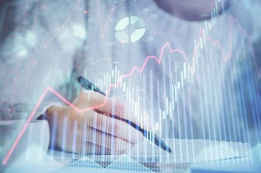 Forex tablosu WOMANS el notları arka plan alarak görüntülenir. Araştırma kavramı. Çoklu pozlama