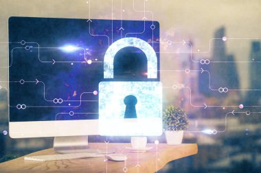 Bilgisayar ve ikon hologramı ile masaüstüne çift pozlama. Veri güvenliği kavramı.