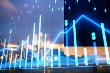 Finansal tablo çizimi ve arka planda bilgisayar olan bir tablo. Çifte maruziyet. Uluslararası pazarlar kavramı.