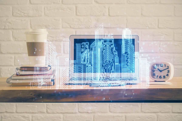 Stolní počítač pozadí v kanceláři a velkých městských budov hologram kresba. Dvojité vystavení. Smart city concept. — Stock fotografie