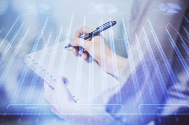 Forex grafik huds ile notlar yapma ellerin çoklu pozlama. Borsa konsepti.