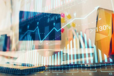 Finansal grafik renkli çizimler ve arka planda bilgisayar olan tablolar. Çifte maruziyet. Uluslararası pazarlar kavramı.