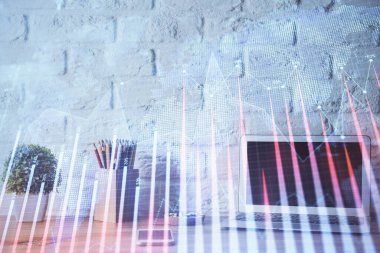 Finansal grafik renkli çizimler ve arka planda bilgisayar olan tablolar. Çifte maruziyet. Uluslararası pazarlar kavramı.