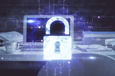 Bilgisayar ve ikon hologramı ile masaüstüne çift pozlama. Veri güvenliği kavramı.