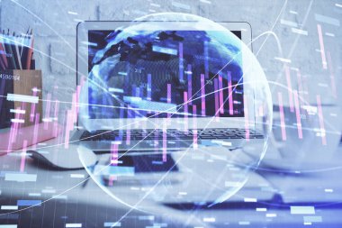 Finansal tablo çizimi ve arka planda bilgisayar olan bir tablo. Çoklu maruz kalma. Uluslararası pazarlar kavramı.