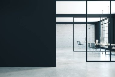 Coworking office interior with blank black wall a