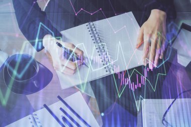 Forex grafik hologram el notları arka plan alarak. Analiz kavramı. Çoklu pozlama