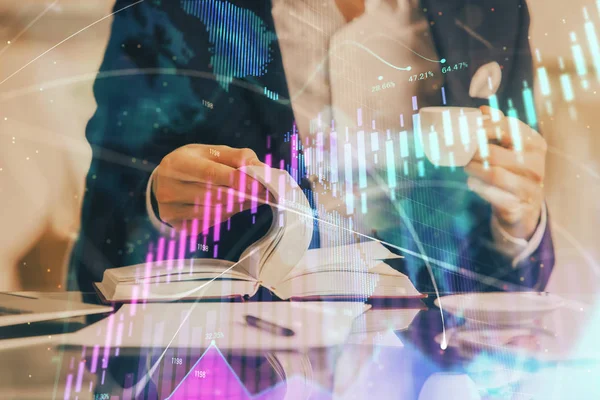 Double exposure of businessman's hands withcup of coffee with stock market graph background. Concept of research and trading.