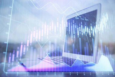 Kişisel bilgisayar arkaplanına çizilmiş borsa hologramı. Çifte maruziyet. Yatırım kavramı.