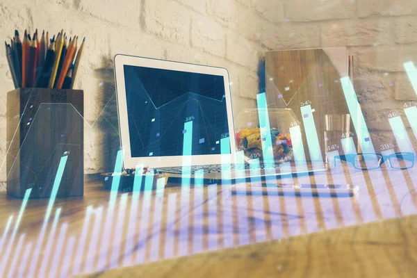 Double exposure of graph and financial info and work space with computer background. Concept of international online trading.