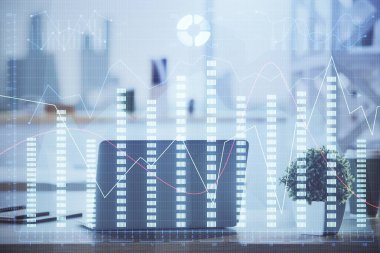 Finansal tablo çizimi ve arka planda bilgisayar olan bir tablo. Çifte maruziyet. Uluslararası pazarlar kavramı.