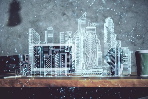 Fondo de escritorio de la computadora en la oficina y grandes edificios de la ciudad holograma dibujo. Doble exposición. Concepto de ciudad inteligente. — Foto de Stock