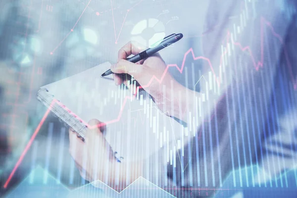 Multi exposure of hands making notes with forex chart huds. Stock market concept. — Stock Photo, Image