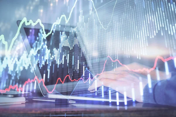 Double exposure of stock market graph with man working on laptop on background. Concept of financial analysis.