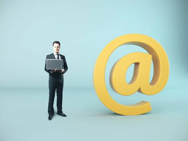 Businessman Holding Laptop Big Yellow Mail Symbol Business Communication Concept — Stock Photo, Image