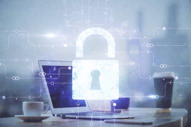 Bilgisayar ve ikon hologramı ile masaüstüne çift pozlama. Veri güvenliği kavramı.