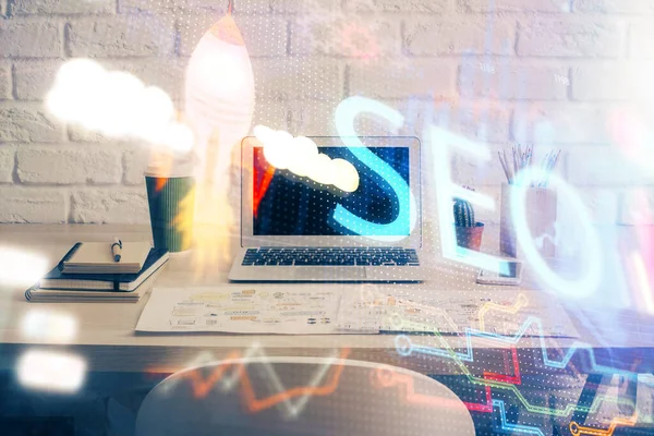 Multi exposure of table with computer and seo drawing hologram. Search optimization concept. — Stock Photo, Image