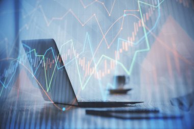 Grafik ve finansal bilgilere çifte maruz kalma ve bilgisayar geçmişi olan çalışma alanı. Uluslararası çevrimiçi ticaret kavramı.