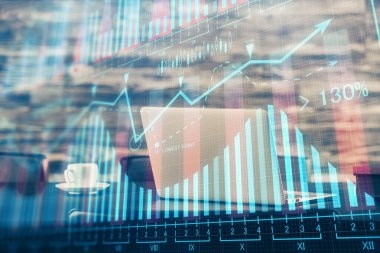 Finansal tablo çizimi ve arka planda bilgisayar olan bir tablo. Çifte maruziyet. Uluslararası pazarlar kavramı.