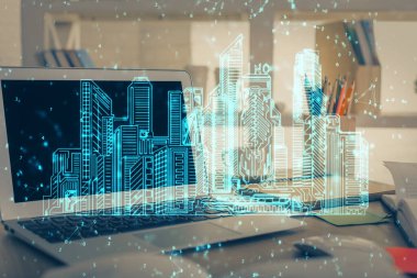 Ofisteki masaüstü bilgisayar geçmişi ve büyük kasaba binaları hologram çizimi. Çifte maruziyet. Akıllı şehir konsepti.