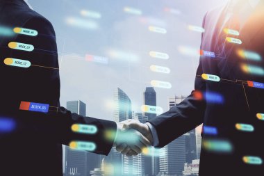 İki kişinin veri temalı hologramı ve el sıkışması. Bilişim endüstrisi konseptinde ortaklık.