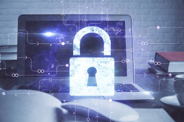 Bilgisayar ve ikon hologramı ile masaüstüne çift pozlama. Veri güvenliği kavramı.