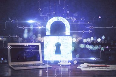 Bilgisayar ve ikon hologramı ile masaüstüne çift pozlama. Veri güvenliği kavramı.