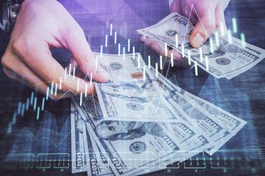 Finansal grafiğe çoklu pozlama hologram, Amerikan dolarları ve insan eli. Analiz kavramı.