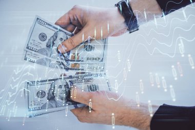 Finansal grafiğe çoklu pozlama hologram, Amerikan dolarları ve insan eli. Analiz kavramı.