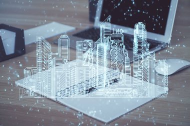 Ofisteki masaüstü bilgisayar geçmişi ve büyük kasaba binaları hologram çizimi. Çifte maruziyet. Akıllı şehir konsepti.