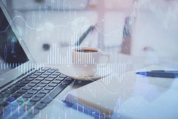 Double exposure of financial chart drawing and desktop with coffee and items on table background. Concept of forex market trading