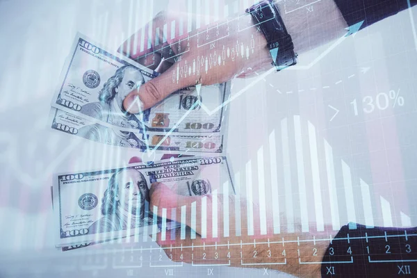Finansal grafiğe çoklu pozlama hologram, Amerikan dolarları ve insan eli. Analiz kavramı. — Stok fotoğraf