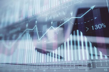 Finansal grafik çizimleri ve açık defter arkaplanı olan bir masa. Önx pazarı kavramı