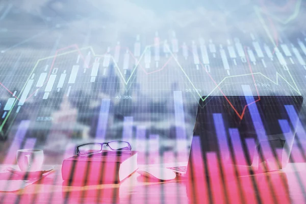 Double exposure of financial chart drawings and desk with open notebook background. Concept of forex market