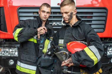 September 03, 2019, Ukraine Lviv city, young pretty and sexy firefighter sits by fire truck