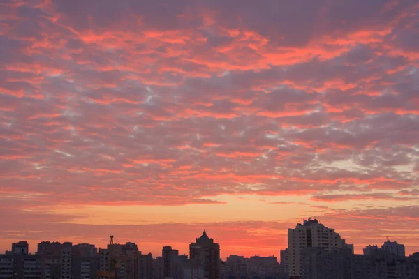 Beautiful clouds over the city at sunrise