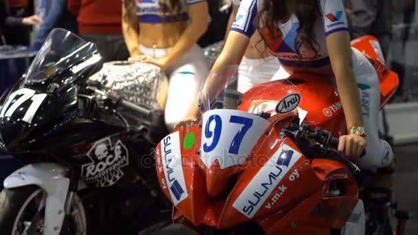 Motorcycle and model girl dispalyed at the big bikes fair. — Stock Video