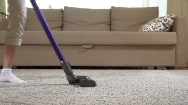 Housewife dancing with a vacuum cleaner. Dolly shot. — Stock Video