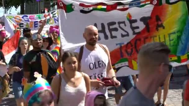 Thousands of people in solidarity during a Gay pride parade on the streets. — Stock Video