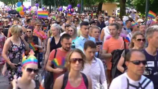 Thousands of people in solidarity during a Gay pride parade on the streets. — Stock Video