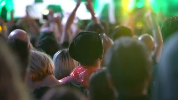 A lot of fans applauding and waving their hands at a rock concert. Heavy metal rock festival Tuska. — Stock Video